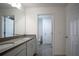 Bathroom with double sinks, modern countertops, and tile flooring at 1371 Red Blossom Ln, Kissimmee, FL 34746