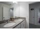 Bright bathroom showcasing a double vanity with stone counters and ample mirror space at 1371 Red Blossom Ln, Kissimmee, FL 34746