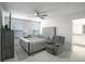 Bedroom with ceiling fan, furniture, carpet, and natural light at 1371 Red Blossom Ln, Kissimmee, FL 34746