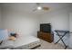 Bright bedroom with carpet, a ceiling fan, a bed with modern bedding, and a flat screen TV at 1371 Red Blossom Ln, Kissimmee, FL 34746