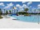A community pool features a water park slide and poolside lounge chairs at 1371 Red Blossom Ln, Kissimmee, FL 34746