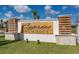 An attractive community sign reads, 'Cypress HAMMOCK' in appealing black lettering at 1371 Red Blossom Ln, Kissimmee, FL 34746