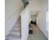 Bright foyer and staircase with a modern decor at 1371 Red Blossom Ln, Kissimmee, FL 34746