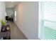 Long hallway with lots of light leading to the living room at 1371 Red Blossom Ln, Kissimmee, FL 34746