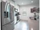 Modern kitchen featuring stainless steel appliances and ample counter space at 1371 Red Blossom Ln, Kissimmee, FL 34746