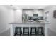 Modern kitchen featuring an island with seating, stainless steel appliances, and sleek countertops at 1371 Red Blossom Ln, Kissimmee, FL 34746