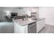 Bright, open kitchen featuring stainless steel appliances and island seating at 1371 Red Blossom Ln, Kissimmee, FL 34746