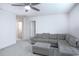 Cozy living room with carpeted floor and comfortable furniture at 1371 Red Blossom Ln, Kissimmee, FL 34746