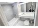 Modern bathroom featuring sleek fixtures, a tub, and a washing machine at 151 E Washington St # 327, Orlando, FL 32801
