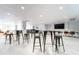 Spacious common area featuring tables, chairs, and a TV for group activities and socializing at 151 E Washington St # 327, Orlando, FL 32801