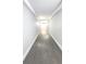 Hallway with gray flooring and white walls at 151 E Washington St # 327, Orlando, FL 32801