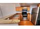 Well-equipped kitchen featuring stainless steel appliances, countertops, and wood floors at 151 E Washington St # 327, Orlando, FL 32801