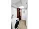 Functional laundry room featuring modern appliances and storage at 151 E Washington St # 327, Orlando, FL 32801