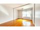 Spacious living room features hardwood floors and large window at 151 E Washington St # 327, Orlando, FL 32801