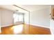 Bright living room with hardwood floors and sunlit window at 151 E Washington St # 327, Orlando, FL 32801
