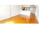 Bright living room featuring hardwood floors and a view into the kitchen at 151 E Washington St # 327, Orlando, FL 32801