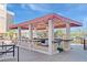 Outdoor bar and seating area featuring modern amenities and a spacious covered area, ideal for social gatherings at 151 E Washington St # 327, Orlando, FL 32801