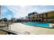Inviting pool area with lounge chairs and a beautiful clubhouse at 151 E Washington St # 327, Orlando, FL 32801