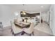 Open-concept living and dining area with access to the kitchen and other rooms at 15687 Kinnow Mandarin Ln, Winter Garden, FL 34787