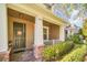 Charming two-story home with well-manicured lawn and a welcoming front porch at 15687 Kinnow Mandarin Ln, Winter Garden, FL 34787