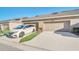 Exterior shot of a home featuring a two-car garage and a driveway with a parked minivan at 15687 Kinnow Mandarin Ln, Winter Garden, FL 34787