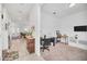 Open-concept living room and office with tile flooring, providing space for relaxation and work at 15687 Kinnow Mandarin Ln, Winter Garden, FL 34787
