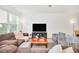Comfortable living room area bathed in natural light, offering a welcoming atmosphere at 15687 Kinnow Mandarin Ln, Winter Garden, FL 34787