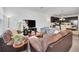 Open-concept layout connecting the living room and kitchen, complete with modern furnishings at 15687 Kinnow Mandarin Ln, Winter Garden, FL 34787