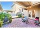 Charming brick patio with a table, chairs, and a grill, perfect for outdoor dining and entertaining at 15687 Kinnow Mandarin Ln, Winter Garden, FL 34787