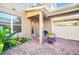 Lovely brick patio with seating and lush greenery, providing a tranquil outdoor living space at 15687 Kinnow Mandarin Ln, Winter Garden, FL 34787
