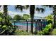 Community swimming pool surrounded by lush landscaping and palm trees, perfect for relaxation at 15687 Kinnow Mandarin Ln, Winter Garden, FL 34787