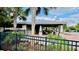 Shaded community pavilion with comfortable seating by the pool at 15687 Kinnow Mandarin Ln, Winter Garden, FL 34787