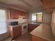 Functional kitchen with laminate countertops and wood cabinets at 20 S Flag Ct, Kissimmee, FL 34759