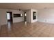 Open-concept living room with tiled floor and natural light at 20 S Flag Ct, Kissimmee, FL 34759