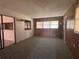 Cozy sun room with wood paneling and plenty of natural light at 20 S Flag Ct, Kissimmee, FL 34759