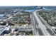 Aerial view of the neighborhood with a house situated near the water and highways at 204 E Harvard St, Orlando, FL 32804
