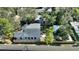 Aerial view showcases the property's layout, backyard, and surrounding trees at 204 E Harvard St, Orlando, FL 32804
