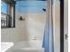 Clean bathroom features a white tiled shower with updated fixtures and a window for natural light at 204 E Harvard St, Orlando, FL 32804