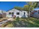 Back of house featuring clean siding, black trim, and small yard at 204 E Harvard St, Orlando, FL 32804