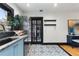 Charming kitchen with granite countertops, stainless steel fridge, and eye-catching tile flooring at 204 E Harvard St, Orlando, FL 32804