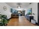 Open-concept kitchen features blue cabinetry, stainless steel appliances, and a breakfast bar at 204 E Harvard St, Orlando, FL 32804