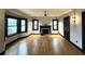 Bright living room featuring hardwood floors, a fireplace, and large windows that flood the space with natural light at 204 E Harvard St, Orlando, FL 32804