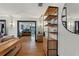 Open-concept living room with hardwood floors and a view into the kitchen area at 204 E Harvard St, Orlando, FL 32804