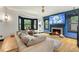 Cozy living room featuring a modern fireplace, bay window and hardwood flooring at 204 E Harvard St, Orlando, FL 32804