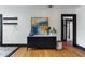 Living room features a stylish sideboard with decorative art, plants and sleek furnishings at 204 E Harvard St, Orlando, FL 32804