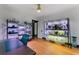 Bright, versatile room with hardwood floors, shelving, and large windows at 204 E Harvard St, Orlando, FL 32804