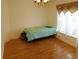 Bright bedroom with hardwood floors and large window at 2160 Addison Ave, Clermont, FL 34711
