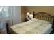 Cozy bedroom with decorative iron bed frame and soft lighting at 2160 Addison Ave, Clermont, FL 34711