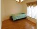 Bright bedroom with hardwood floors and large window at 2160 Addison Ave, Clermont, FL 34711