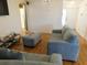 Inviting living room features hardwood floors and comfortable seating, perfect for relaxation at 2160 Addison Ave, Clermont, FL 34711